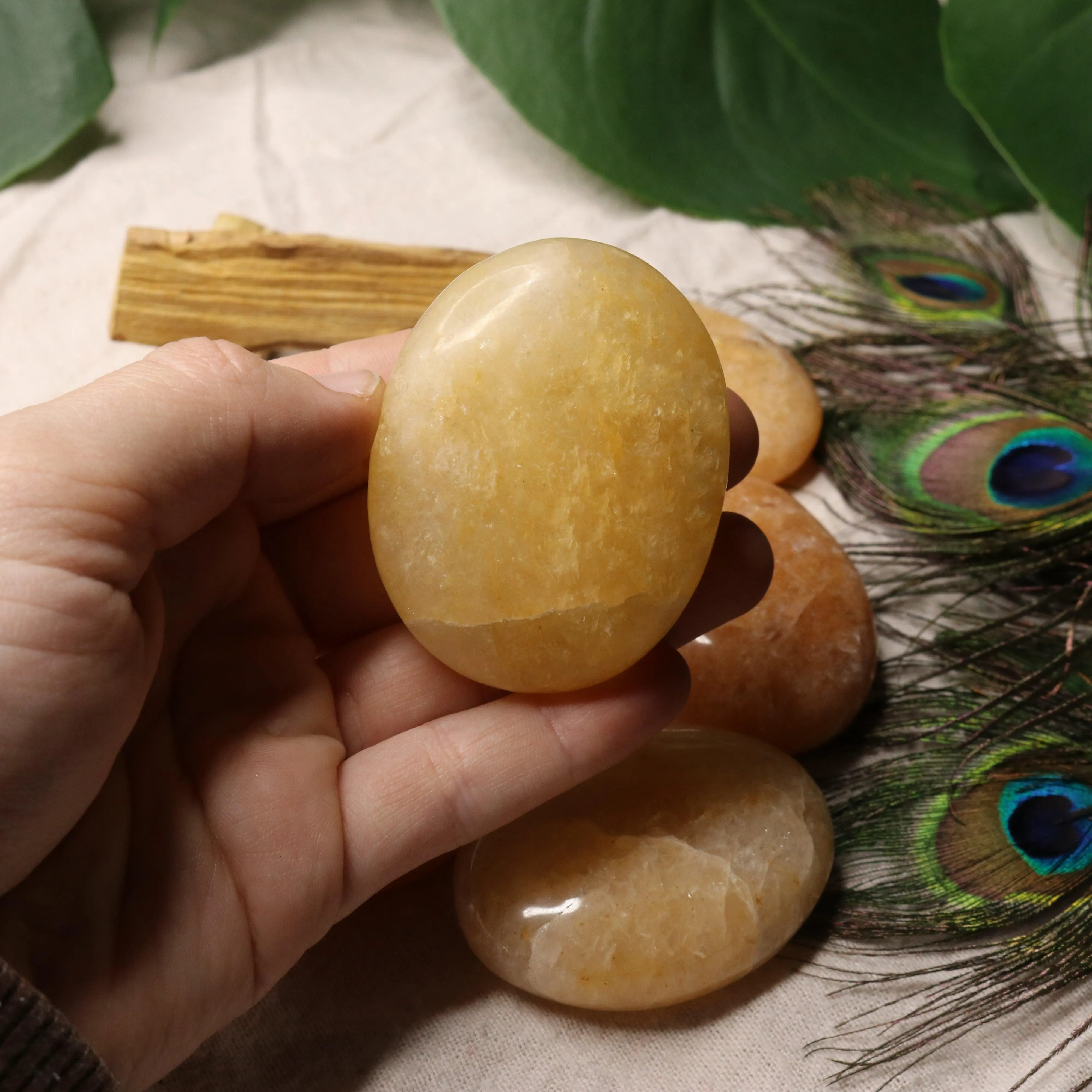 Golden Healer Quartz Pillow Palm Carvings