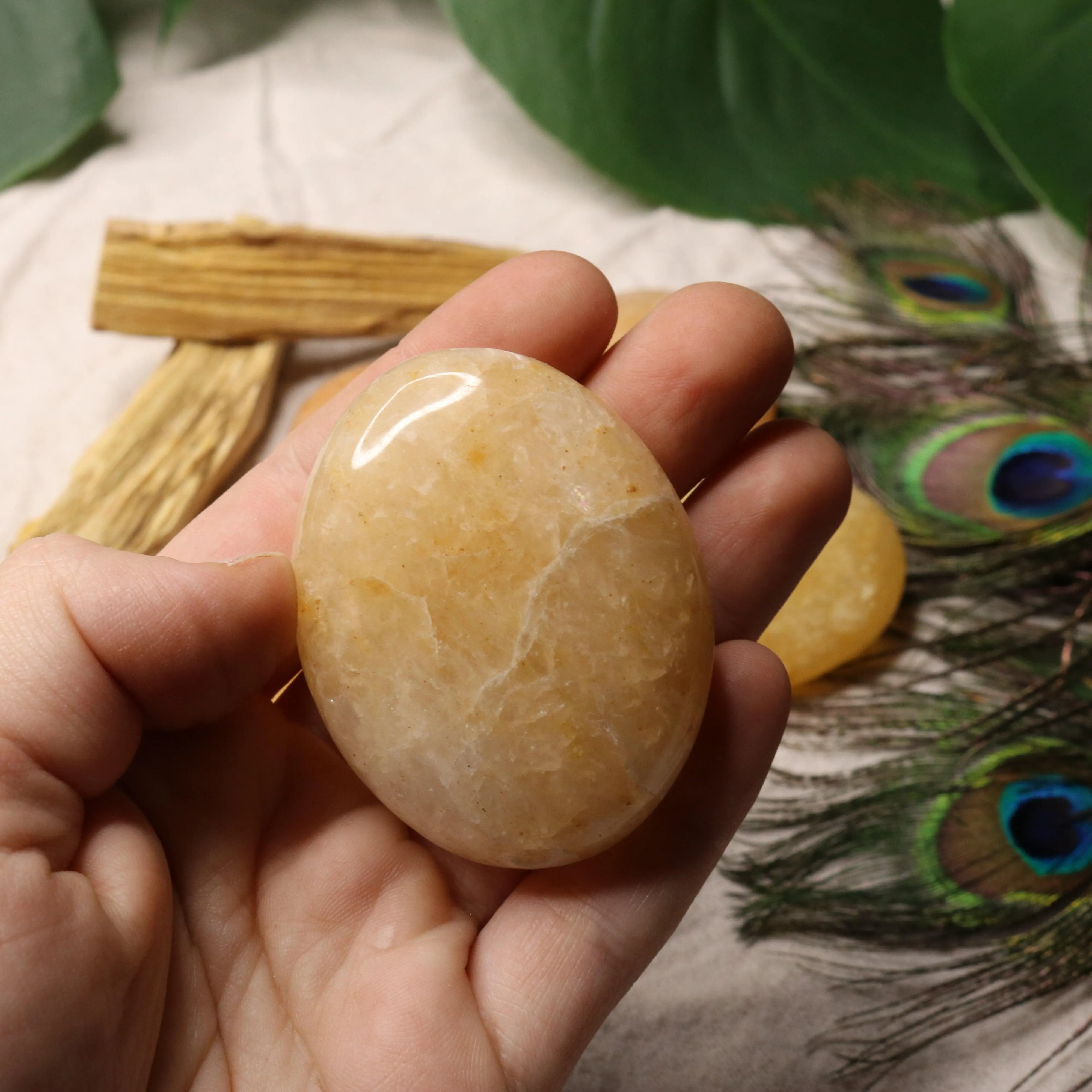 Golden Healer Quartz Pillow Palm Carvings